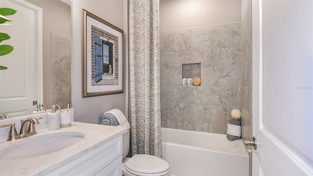 full bathroom featuring shower / tub combo with curtain, vanity, and toilet