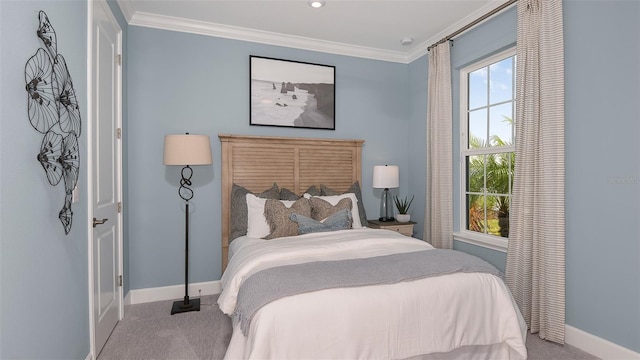 bedroom with crown molding and carpet floors