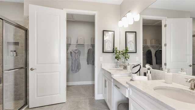 bathroom featuring tile patterned floors, vanity, and walk in shower