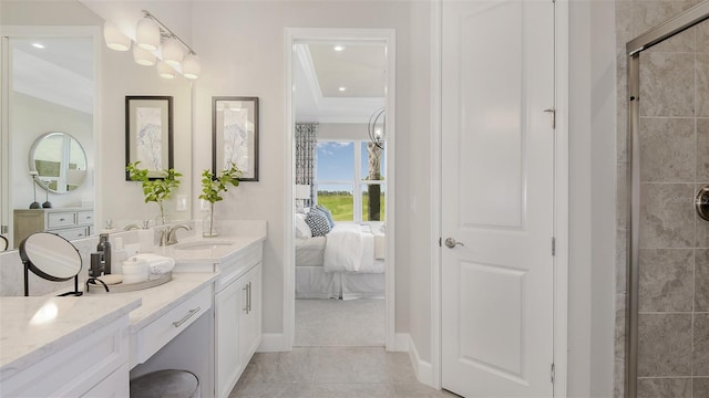 bathroom featuring tile patterned flooring, vanity, and an enclosed shower