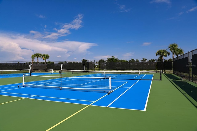 view of tennis court featuring basketball court