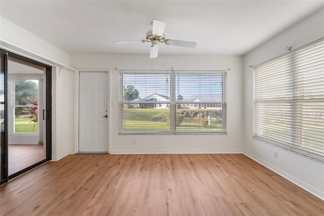 spare room featuring ceiling fan and light hardwood / wood-style flooring