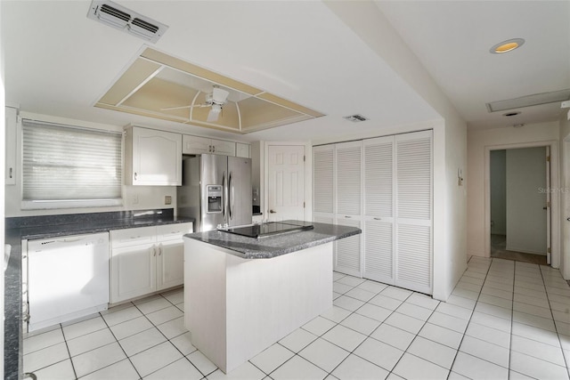 kitchen featuring white cabinetry, dishwasher, a center island, stainless steel fridge with ice dispenser, and black electric cooktop