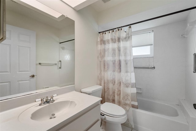 full bathroom with vanity, shower / bath combo, and toilet