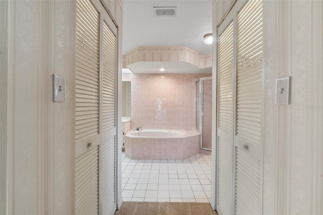 bathroom with plus walk in shower and tile patterned floors