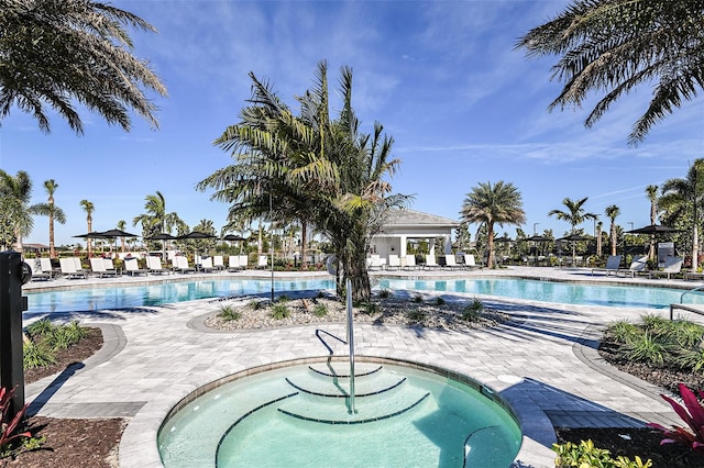 community pool with a patio area