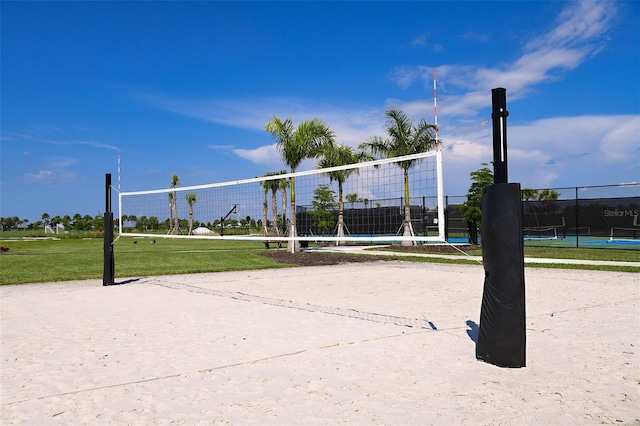 view of community with fence and volleyball court