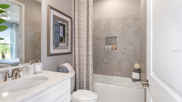 full bathroom featuring vanity, shower / tub combo with curtain, and toilet