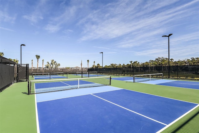 view of sport court with basketball hoop