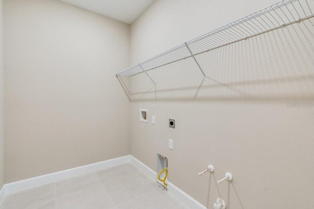 laundry room with light tile patterned floors, gas dryer hookup, hookup for a washing machine, laundry area, and baseboards