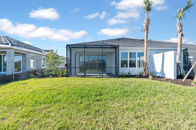 back of house with a lawn