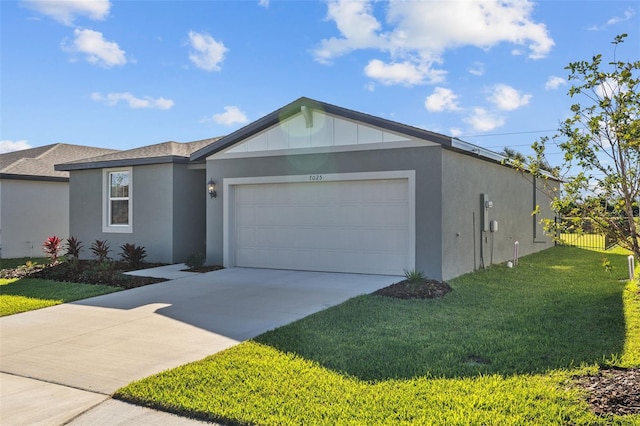 ranch-style house featuring a garage and a front yard