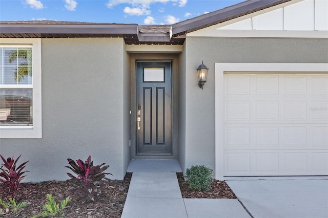 property entrance featuring a garage