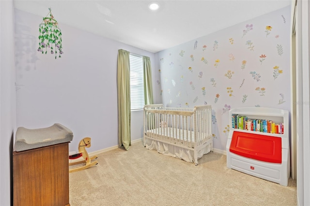 bedroom with carpet flooring and a crib