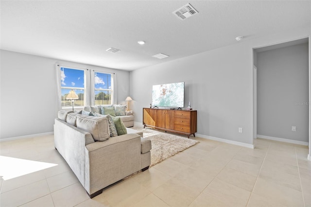 living room featuring light tile patterned flooring