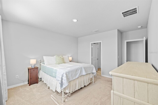 bedroom with light colored carpet