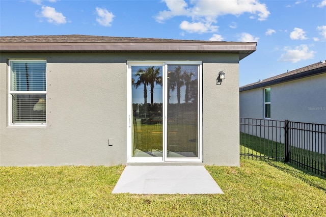 entrance to property with a yard