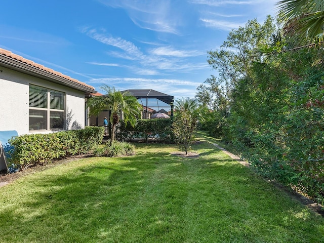 view of yard with a lanai