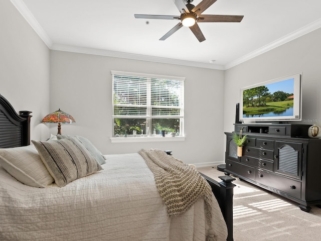 bedroom with carpet, ceiling fan, and crown molding