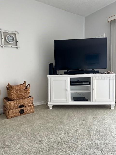 unfurnished living room featuring carpet