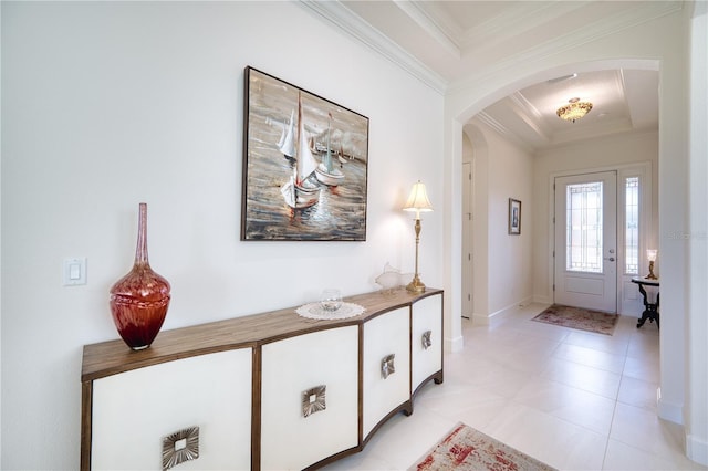 foyer featuring a tray ceiling and crown molding