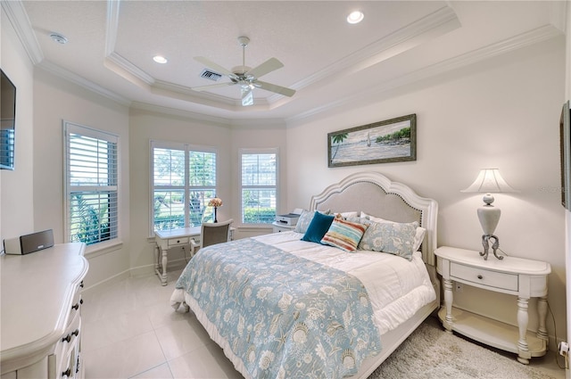 tiled bedroom featuring a tray ceiling, ceiling fan, and crown molding