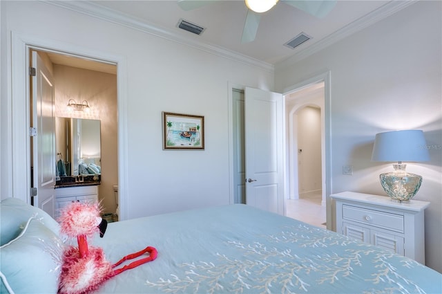 bedroom with ceiling fan and ornamental molding