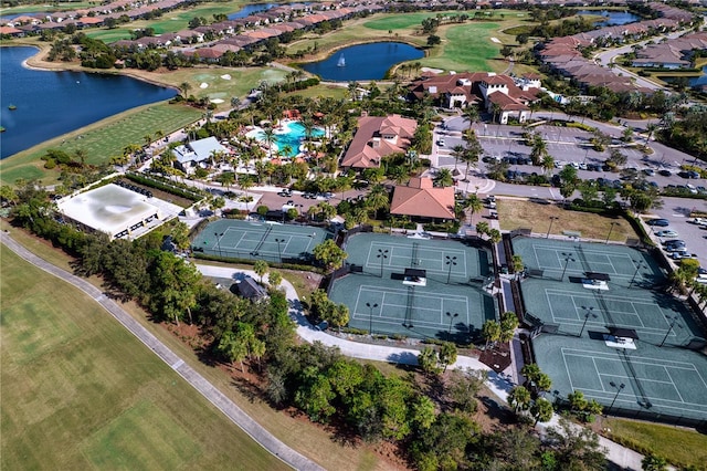 birds eye view of property with a water view