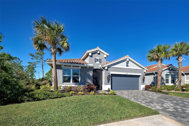 view of front of property with a front lawn and a garage