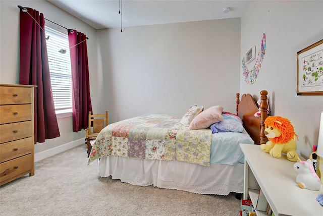 bedroom featuring light colored carpet