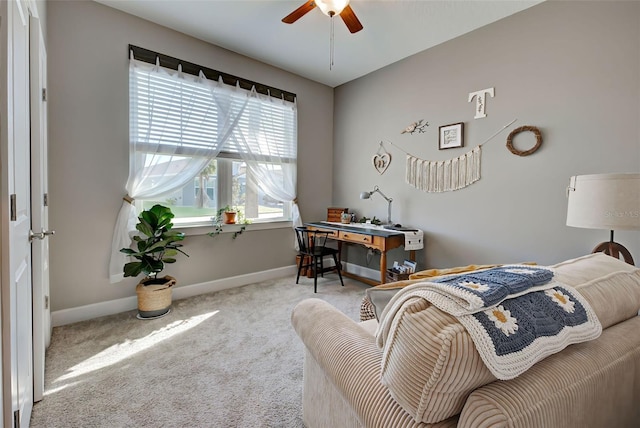 bedroom with ceiling fan and light carpet