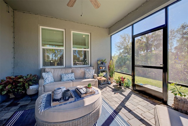 sunroom / solarium with ceiling fan