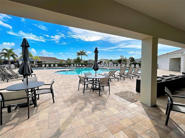 view of swimming pool featuring a patio