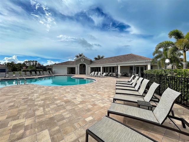 view of swimming pool with a patio