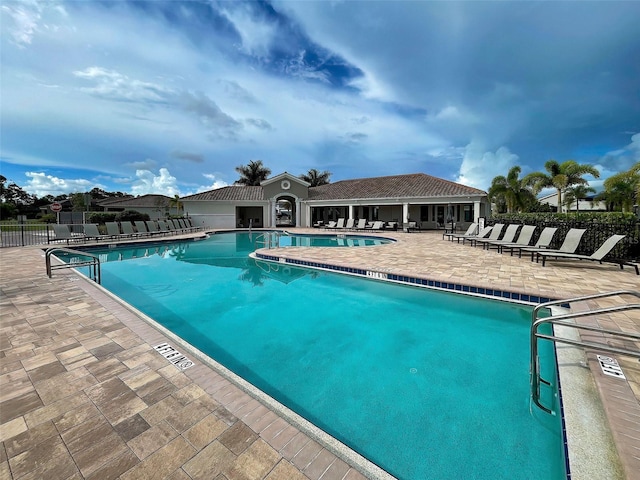 view of swimming pool with a patio