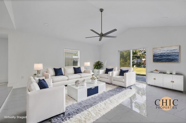 living room with lofted ceiling, a healthy amount of sunlight, and ceiling fan