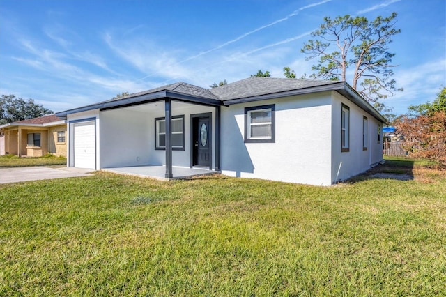 ranch-style house with stucco siding, a front yard, concrete driveway, and an attached garage