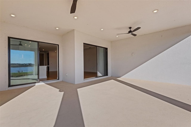 view of patio featuring ceiling fan