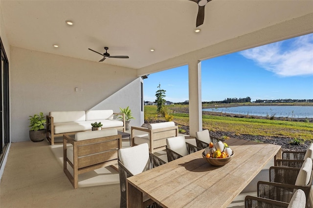 view of patio / terrace with outdoor lounge area and a water view