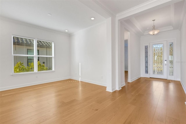 entryway featuring light wood-type flooring and crown molding