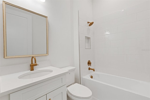 full bathroom featuring toilet, tiled shower / bath combo, and vanity