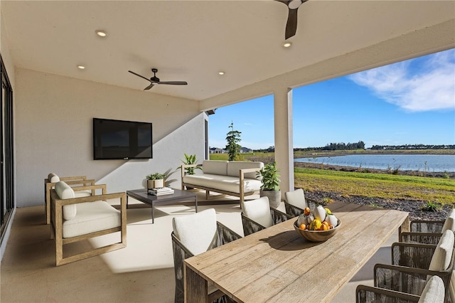 view of patio featuring outdoor lounge area, outdoor dining space, and ceiling fan