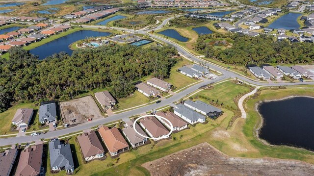 birds eye view of property featuring a residential view and a water view