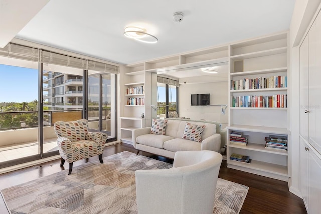 sitting room with hardwood / wood-style flooring