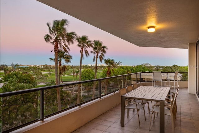 view of balcony at dusk