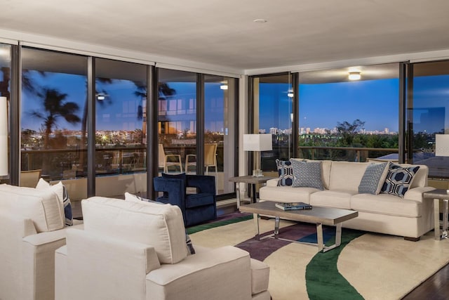 interior space featuring hardwood / wood-style floors, floor to ceiling windows, and a wealth of natural light