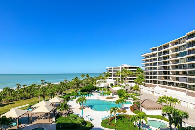 birds eye view of property with a water view