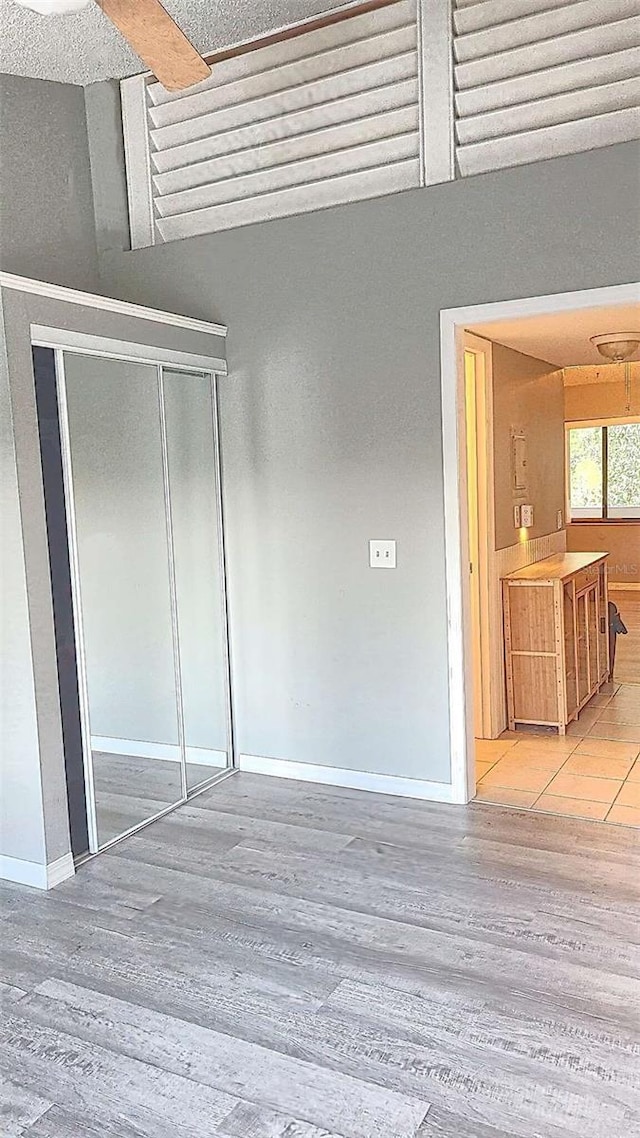 interior space with hardwood / wood-style floors and a closet