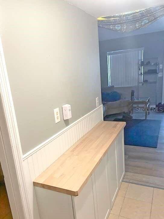 bathroom with hardwood / wood-style floors