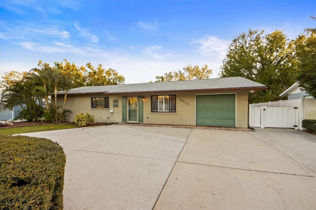 ranch-style home featuring a garage